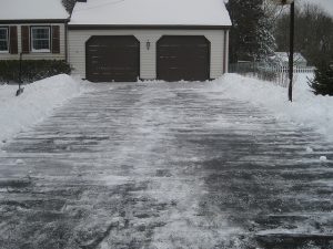 Protect Your Garage Door Against Snow - Snowy-Driveway-300x225