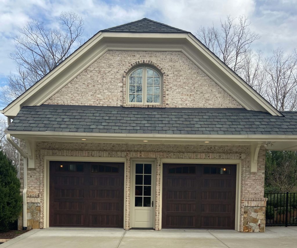 wood tone stamped carriage garage doors 1 scaled