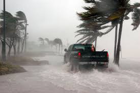 Repairing Your Garage Door After a Hurricane - truck-driving-through-hurricane