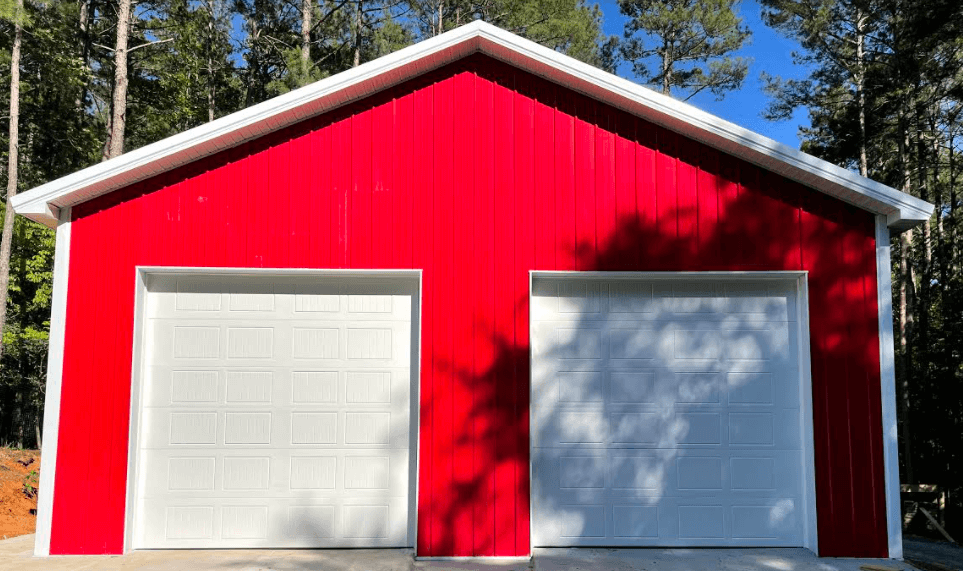 white garage doors red house