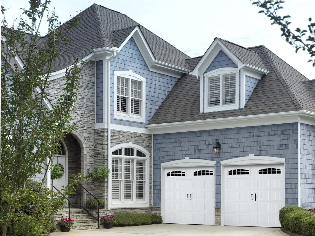 garage doors in blue house