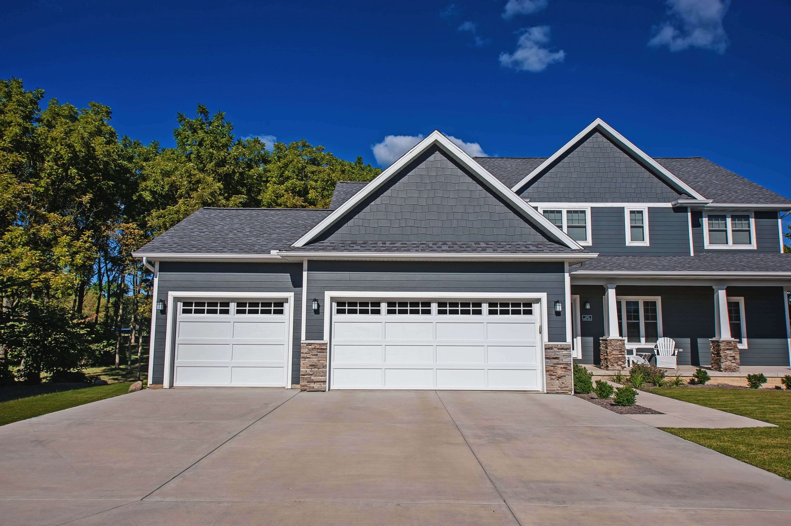 Blue house with white garage door