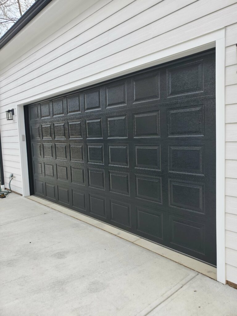 Raised panel garage door black